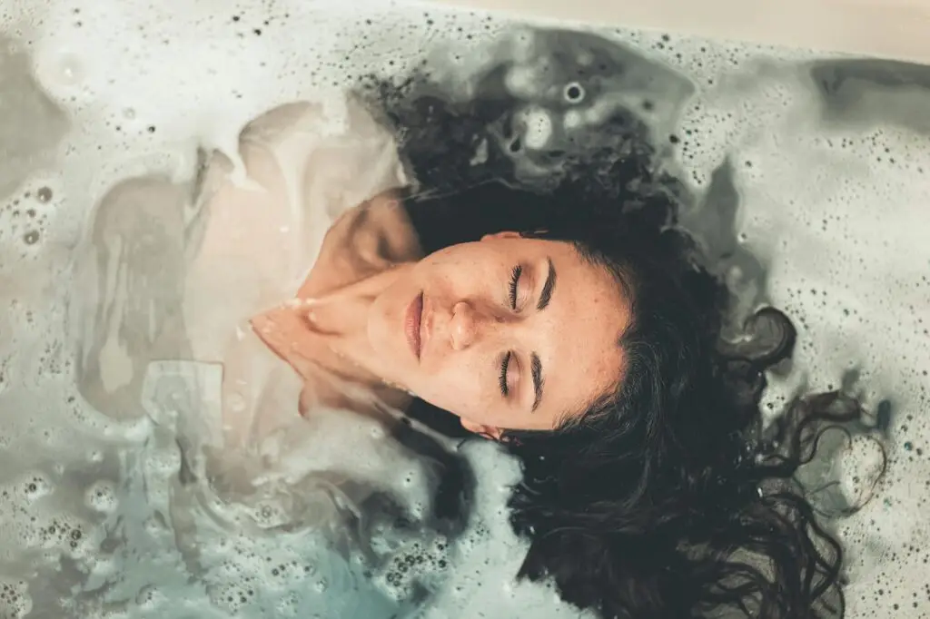 woman in white dress in bath tub