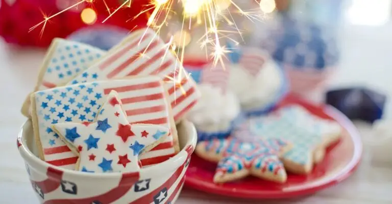 Delicious American flag-themed cookies with sparklers for a Fourth of July celebration.